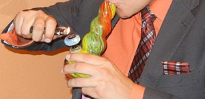 A U.S. Marine Corps veteran who claims he suffers from PTSD takes a bong hit in this 2014 photo. Ray Stern