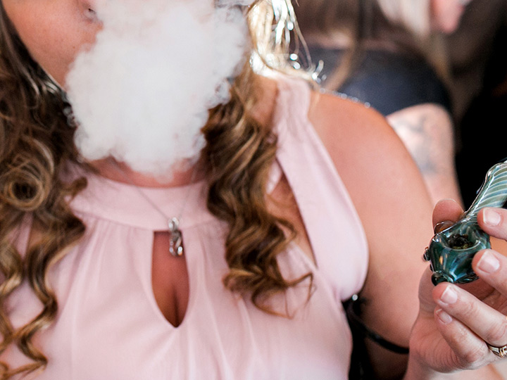 A wedding guest enjoying the venue's "weed bar."