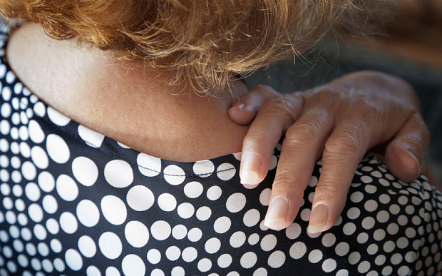 A woman suffereing from joint pain Photo: Alamy