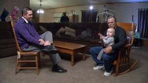 Jeff Mizanskey holds his great-granddaughter, Arreia, while at the dinner table with his family in Sedalia, MO.