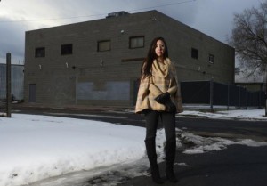 Community organizer Candi CdeBaca stands outside a Denver warehouse that is used for marijuana cultivation on Dec. 22, 2015. (Brent Lewis, The Denver Post)