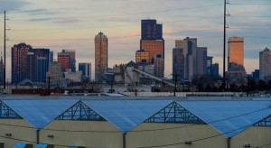 The background of the Denver skyline sits above Greenwerkz grow houses on the 800 block of Wyandot Street on December 30, 2015 in Denver, Colorado. One of the fears of the legalization of marijuana was that pot businesses would find places to call home in low income, mostly minority neighborhoods, which according to some is exactly what happened. (Brent Lewis, The Denver Post)