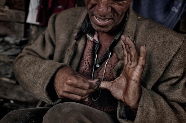 Villagers produce a valuable type of hashish called charas by rubbing parts of the still-living cannabis plants on their hands, then collecting the resin from their palms. PHOTOGRAPH BY ANDREA DE FRANCISCIS