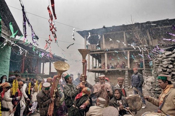 Musicians play at a young couple's marriage celebration in the village square. Parties and festivals in the villages are like big family gatherings, with music, food, and dancing. PHOTOGRAPH BY ANDREA DE FRANCISCIS