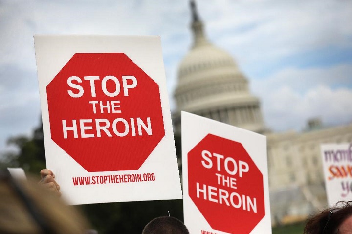 WASHINGTON, DC - SEPTEMBER 18: Activists and family members of loved ones who died in the opioid/heroin epidemic take part in a 'Fed Up!' rally at Capitol Hill on September 18, 2016 in Washington, DC. Protesters called on legislators to provide funding for the Comprehensive Addiction and Recovery Act, which Congress passed in July without funding. Some 30,000 Americans die each year due to heroin and painkiller pill addiction in the United States. (Photo credit: John Moore/Getty Images)